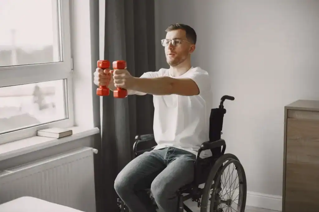 Image of man doing exercise in his wheelchair to aid weight loss Weymouth